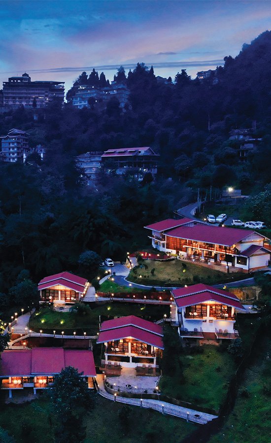 Aerial view of Kaya Gantavya Resort & Spa at dusk, Pelling, Sikkim